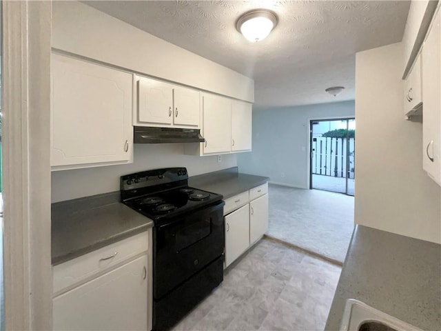 kitchen with white cabinetry, black / electric stove, and a textured ceiling