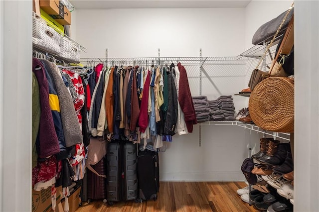 spacious closet with wood finished floors