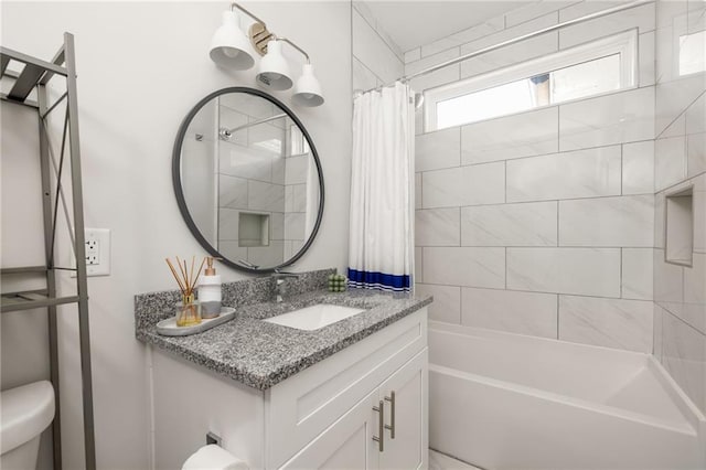 full bathroom with shower / tub combo, vanity, and toilet