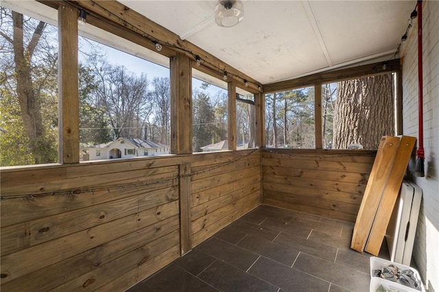 unfurnished sunroom featuring plenty of natural light