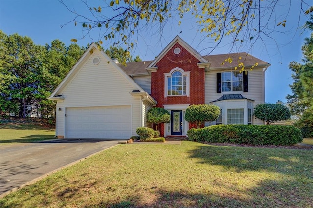 view of front of house with a front yard and a garage