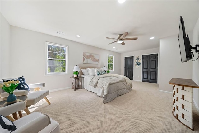 carpeted bedroom with ceiling fan