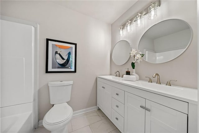 bathroom featuring vanity and toilet