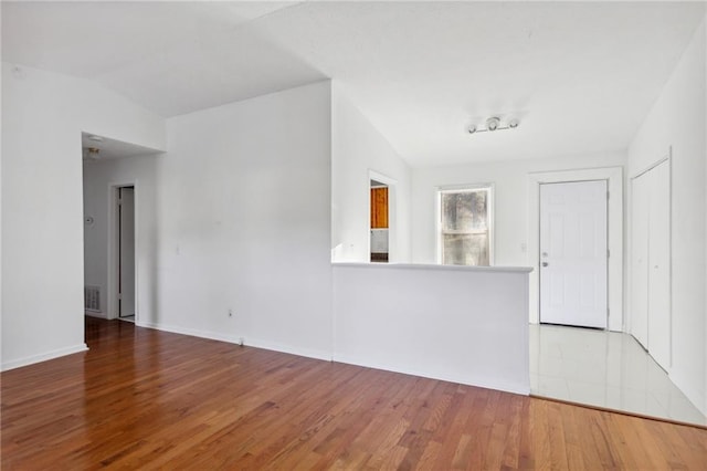 spare room featuring hardwood / wood-style floors