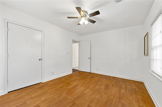 3723 Glenwood Rd, Decatur, GA 30032 - unfurnished bedroom featuring light wood finished floors, baseboards, and ceiling fan