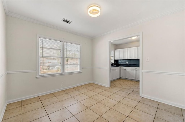 3723 Glenwood Rd, Decatur, GA 30032 - unfurnished room featuring light tile patterned floors, ornamental molding, and baseboards