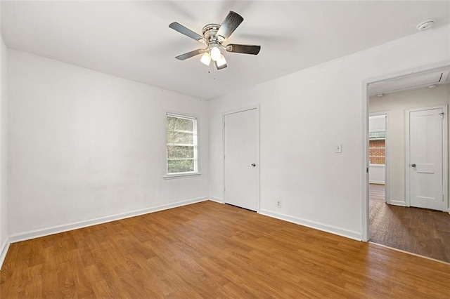 3723 Glenwood Rd, Decatur, GA 30032 - spare room with wood finished floors, baseboards, ceiling fan, attic access, and a smoke detector