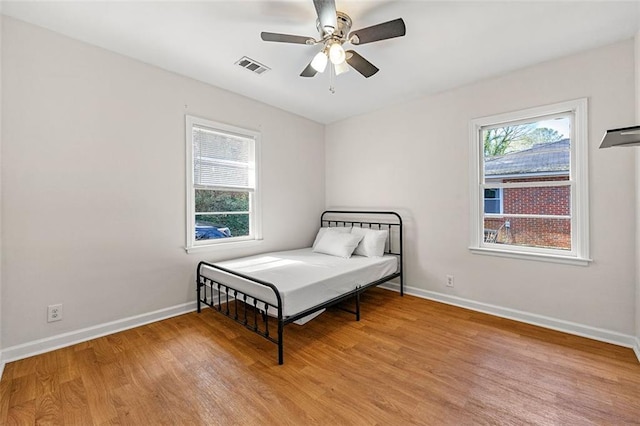 3723 Glenwood Rd, Decatur, GA 30032 - bedroom featuring light wood-style flooring, baseboards, and ceiling fan