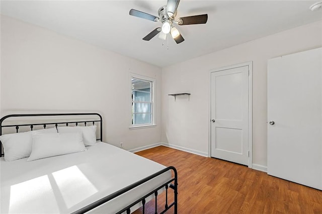 3723 Glenwood Rd, Decatur, GA 30032 - bedroom with wood finished floors, baseboards, and ceiling fan