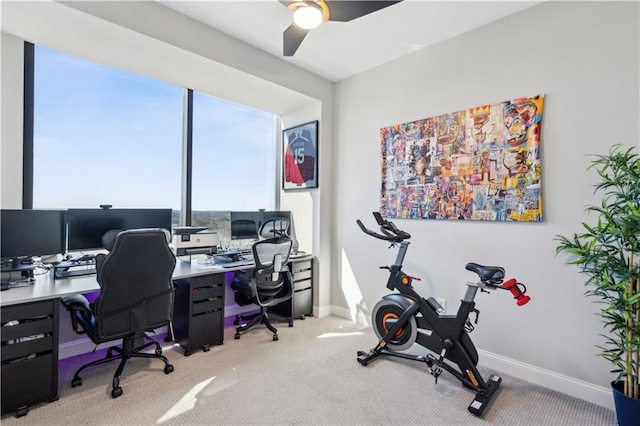 office with baseboards, a ceiling fan, and light colored carpet