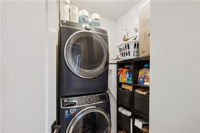 laundry area with stacked washer and clothes dryer