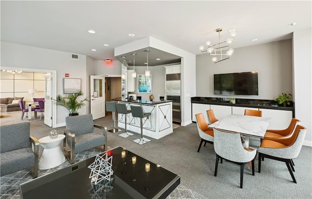 dining area featuring recessed lighting, visible vents, dark carpet, a chandelier, and baseboards