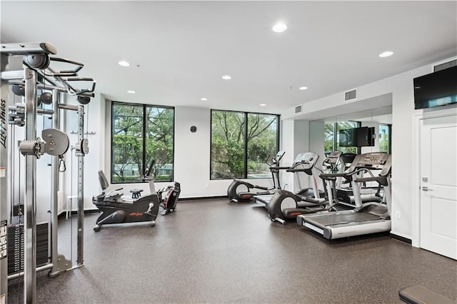 workout area featuring a wealth of natural light, visible vents, and recessed lighting