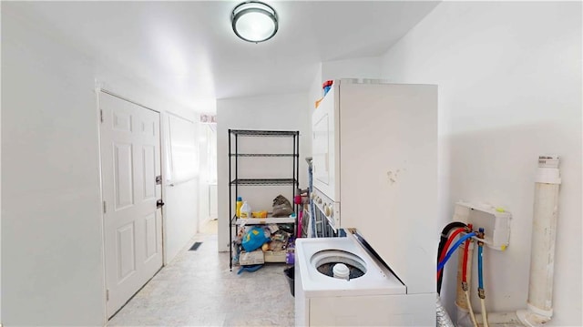 laundry area with stacked washer / dryer