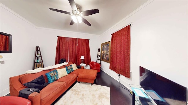 living room with ceiling fan and crown molding