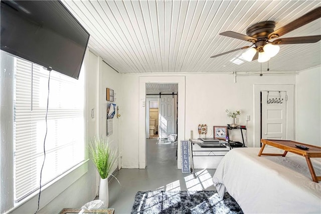 bedroom featuring concrete floors, multiple windows, wooden ceiling, and ceiling fan