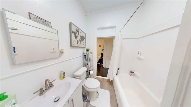 full bathroom with ornamental molding, vanity, shower / bath combo with shower curtain, hardwood / wood-style flooring, and toilet