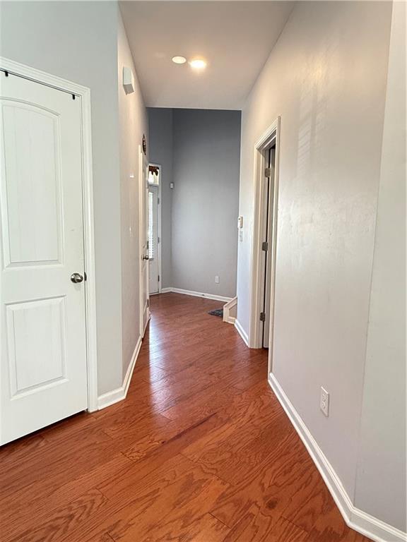 5850 Shiloh Woods Dr, Cumming, GA 30040 - corridor with baseboards, wood finished floors, and recessed lighting