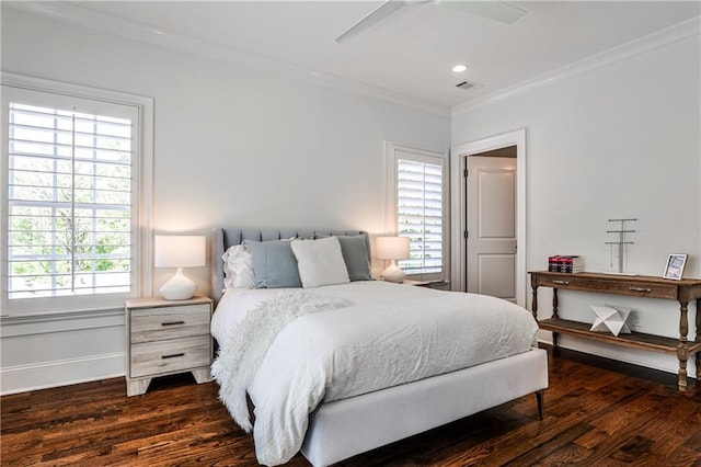 bedroom with dark wood-style floors, ornamental molding, and a ceiling fan