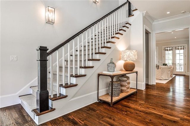 stairs with baseboards, crown molding, recessed lighting, wood finished floors, and french doors