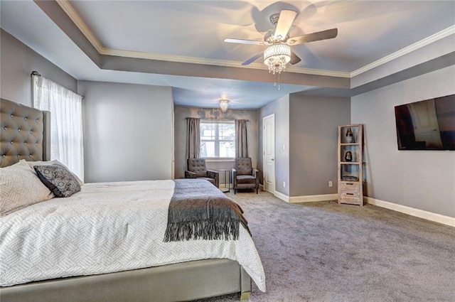 bedroom featuring a raised ceiling, ceiling fan, crown molding, and carpet