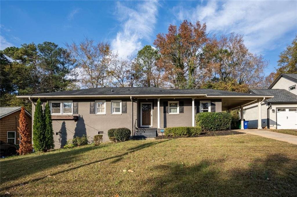 single story home featuring a front yard and a carport