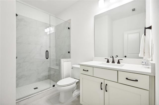 bathroom with vanity, toilet, and walk in shower