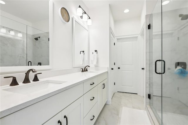 bathroom featuring vanity and an enclosed shower