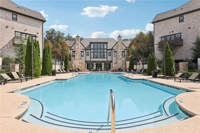 view of swimming pool with a patio