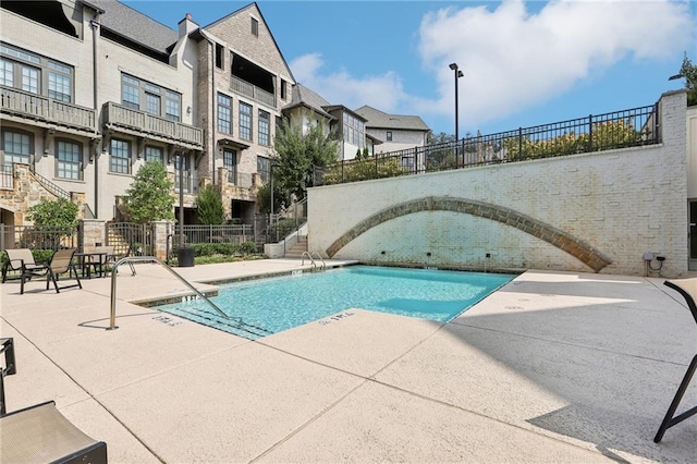 view of pool featuring a patio area