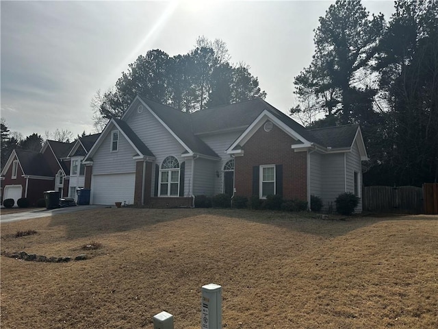 ranch-style home featuring a garage and a front lawn