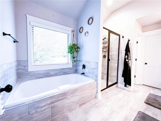 bathroom with shower with separate bathtub