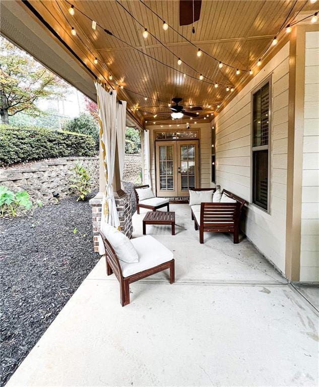 view of patio with french doors, an outdoor living space, and ceiling fan