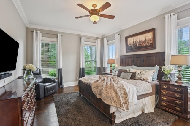 bedroom with multiple windows, dark wood-type flooring, crown molding, a ceiling fan, and baseboards