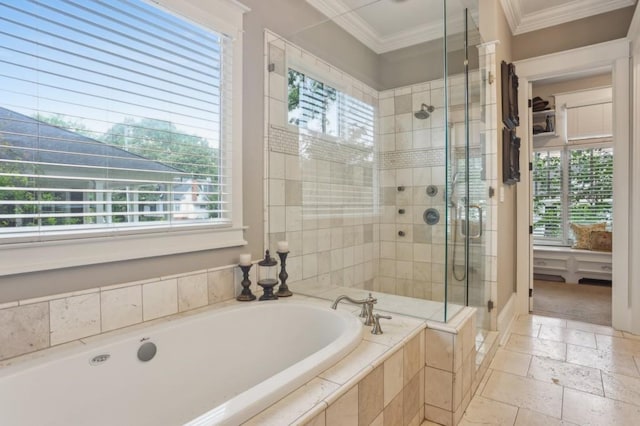 full bath with a stall shower, crown molding, a bath, and stone tile flooring