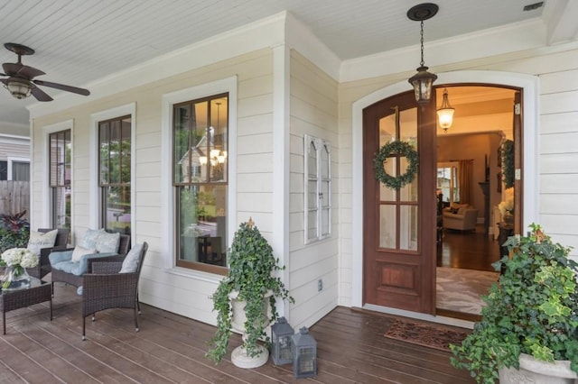 property entrance with covered porch and a ceiling fan