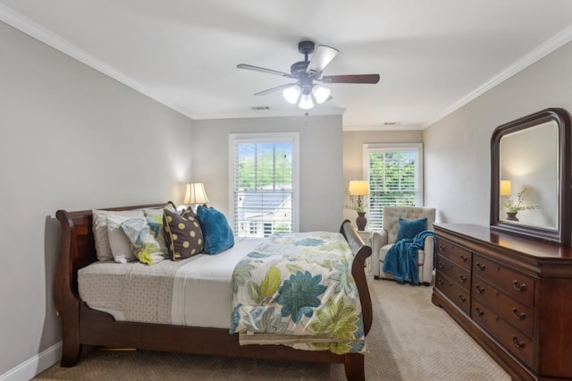 bedroom featuring light carpet, crown molding, and ceiling fan