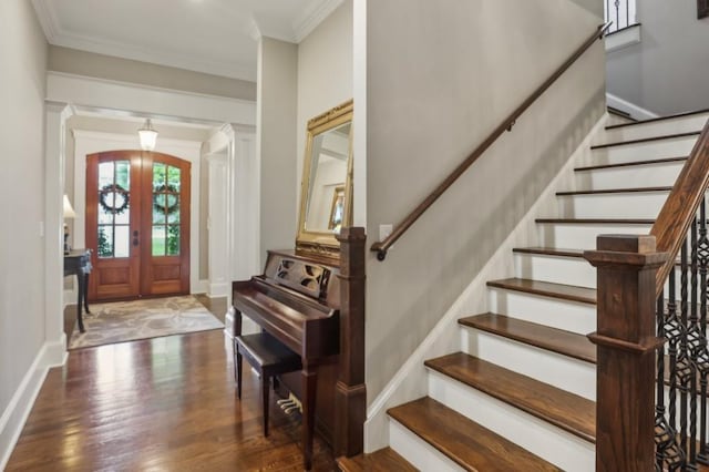 entrance foyer featuring wood finished floors, stairs, ornamental molding, and baseboards