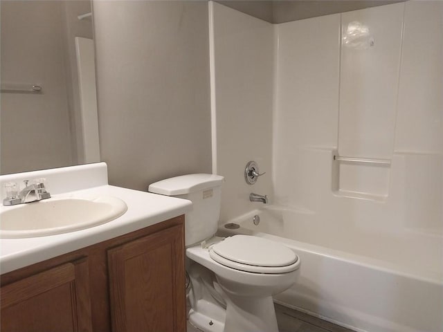 full bathroom with vanity, tub / shower combination, and toilet