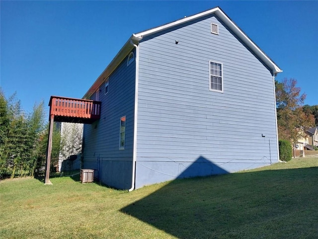 view of side of home featuring a yard