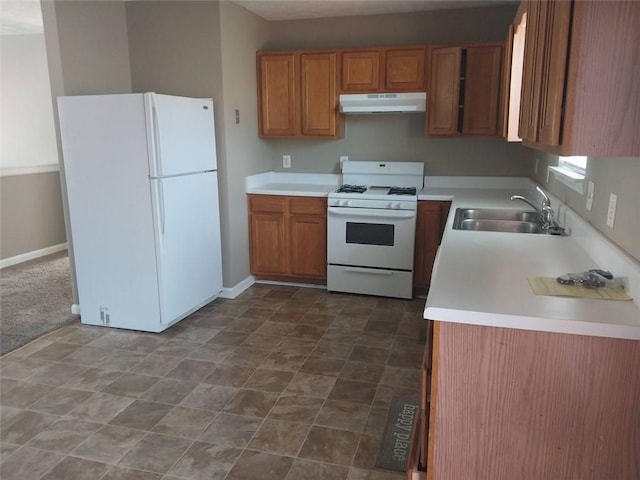 kitchen featuring white appliances and sink