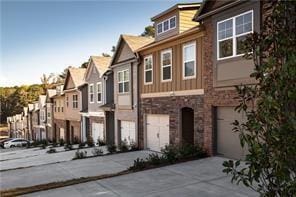 2692 Avanti Way, Decatur, GA 30035 - view of front facade with driveway, a residential view, a garage, and stone siding