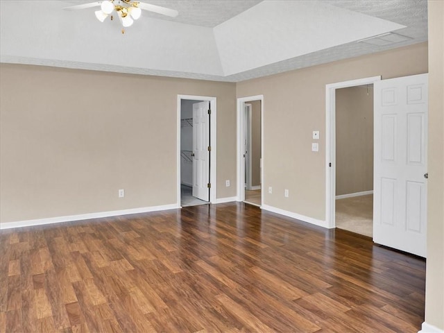 3725 Crescent Walk Ln, Suwanee, GA 30024 - unfurnished bedroom with a spacious closet, wood finished floors, a closet, and lofted ceiling