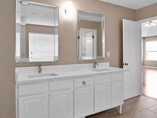 3725 Crescent Walk Ln, Suwanee, GA 30024 - full bathroom with double vanity and a textured ceiling