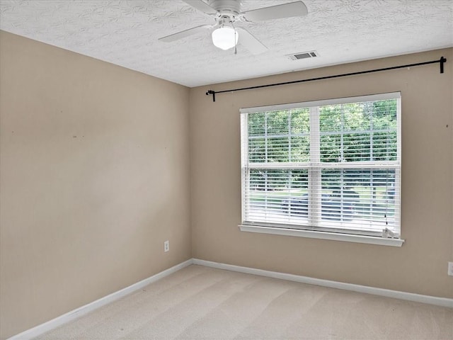 3725 Crescent Walk Ln, Suwanee, GA 30024 - spare room featuring plenty of natural light, light colored carpet, a textured ceiling, and a ceiling fan