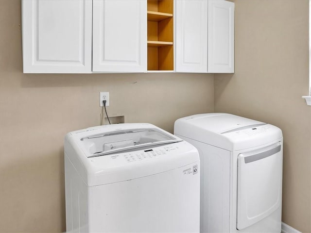 3725 Crescent Walk Ln, Suwanee, GA 30024 - laundry room with cabinet space and washing machine and clothes dryer