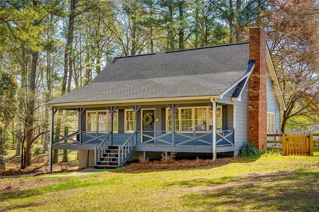 216 Hickory Way, Canton, GA 30115 - view of front of property with covered porch, a chimney, and roof with shingles