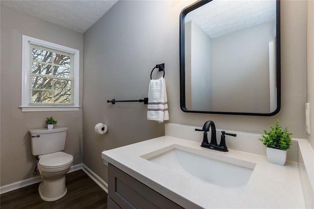 216 Hickory Way, Canton, GA 30115 - bathroom featuring a textured ceiling, wood finished floors, and vanity