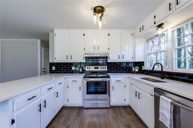 216 Hickory Way, Canton, GA 30115 - kitchen with stainless steel appliances, backsplash, light countertops, and dark wood finished floors