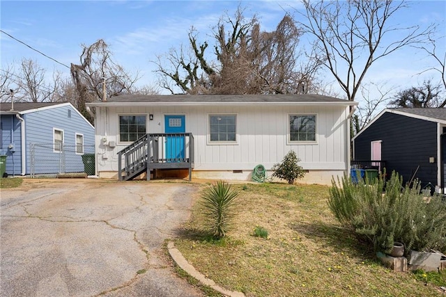 view of front of home with crawl space and driveway